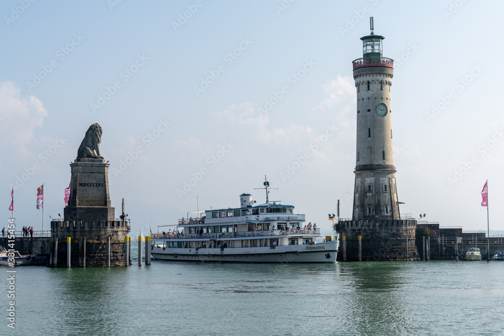 passenger ship enters the protected harbor on Lindau Island on Lake Constance in Bavaria