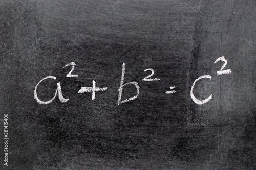 White color chalk hand writing in mathematics formula (Pythagorean theorem or Pythagoras's theorem) on blackboard background