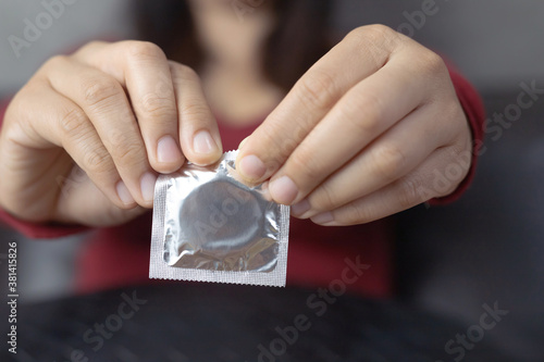 Women carry condoms, concept of sex education.