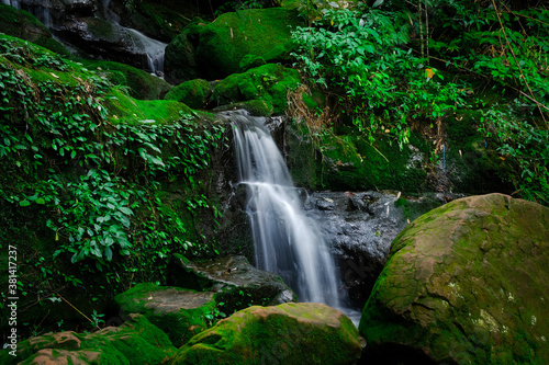 Fototapeta Naklejka Na Ścianę i Meble -  Saithip waterfall are some of the attractions of the park. Beautiful waterfall in deep forest of Phu Soi Dao national park, Uttaradit provinces, northern Thailand