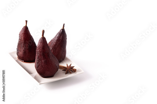 Poached pears in red wine isolated on white background.Copy space
