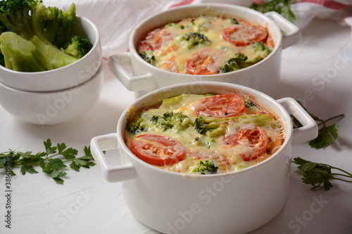 Broccoli, cheese and  egg casserole in baking cocottes