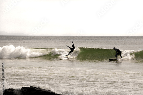sporty surfer falls in the wave