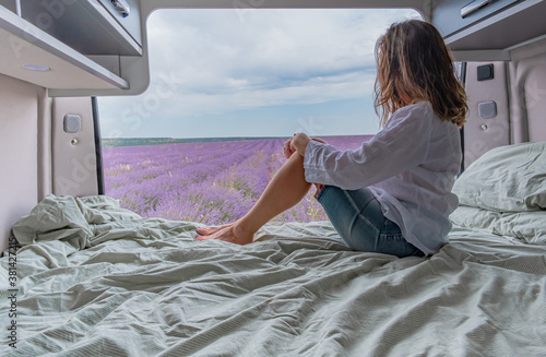 Woman looking at lavender fields from a camper