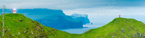 Kalsoy Island and Kallur lighthouse, Faroe Islands, Young Woman in Red Coat On Cliff Edge, Kalsoy Island, Faroe Islands