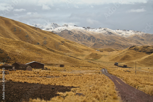 First autumn snow surprised a mountain biker in the Peruvian Andes between Cusco and Puno in South America. photo