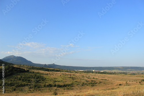 Summer natural landscape with mountains in the background. © Ольга Кожина