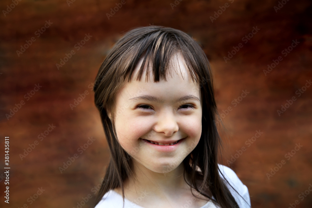 Portrait of little girl smiling on brown background Portrait of little girl smiling on brown background