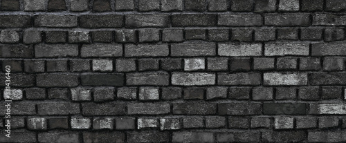 Black clinker bricks from a wall, facade of brick, texture wallpaper