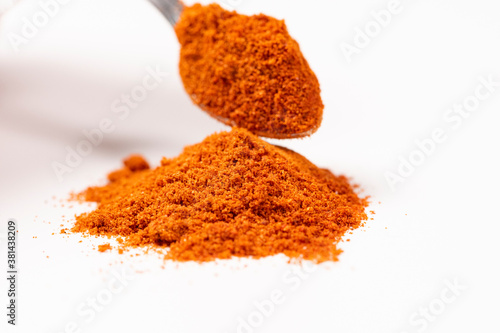 Powdered pimienta roja red pepper pile from top on white background