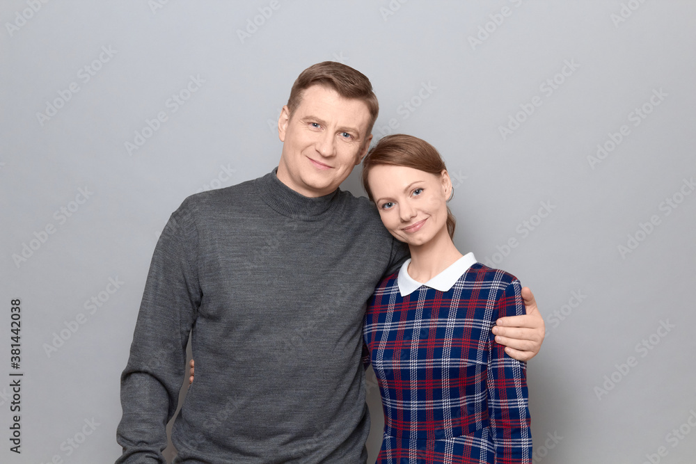 Portrait of happy man and woman hugging each other and smiling Portrait of happy man and woman hugging each other and smiling