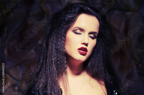 Fototapeta Naklejka Na Ścianę i Meble -  young beautiful lady with magnificent dark hair