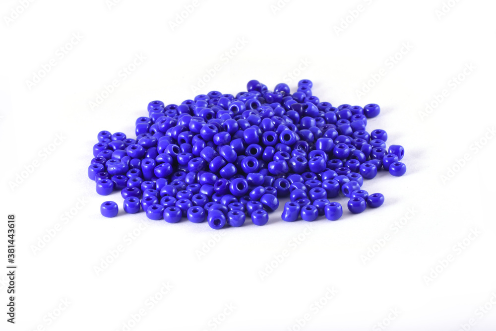 Beads spread on white background. Background or texture of beads. Close up, macro,It is used in finishing fashion clothes. make bead necklace or beads for woman of fashion,Bead Crochet. Daily Beading. Beads spread on white background. Background or texture of beads. Close up, macro,It is used in finishing fashion clothes. make bead necklace or beads for woman of fashion,Bead Crochet. Daily Beading.