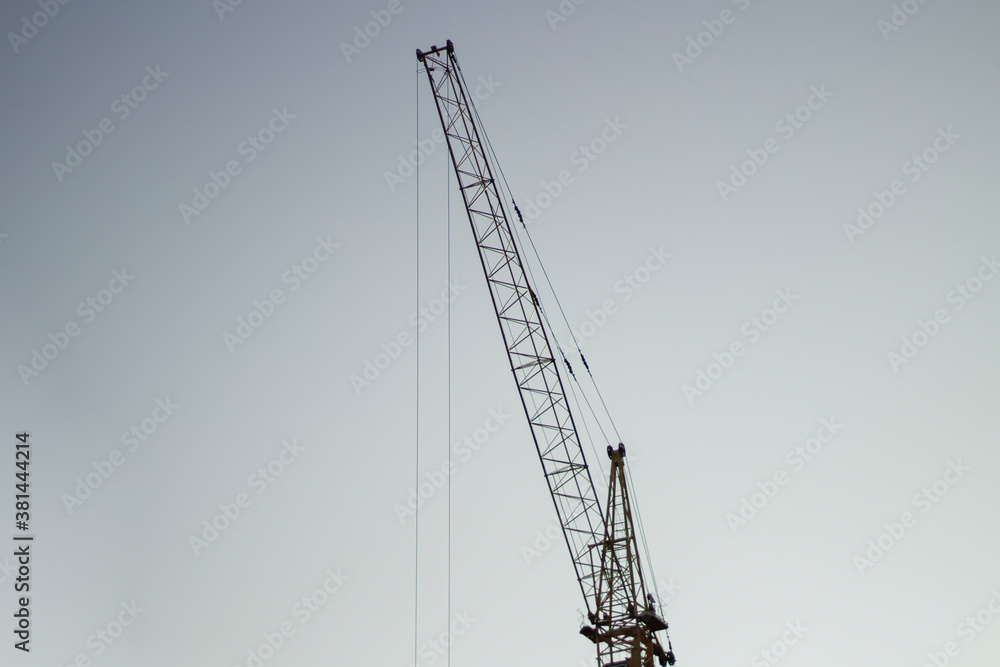 Tower crane at a construction site. Tower crane at a construction site.