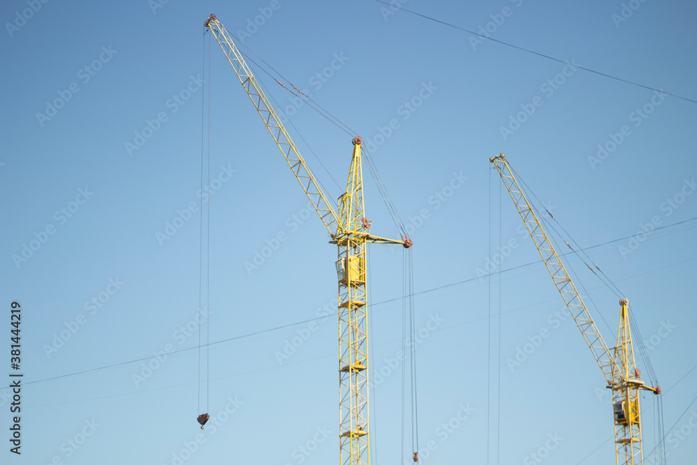 Tower crane at a construction site. Tower crane at a construction site.