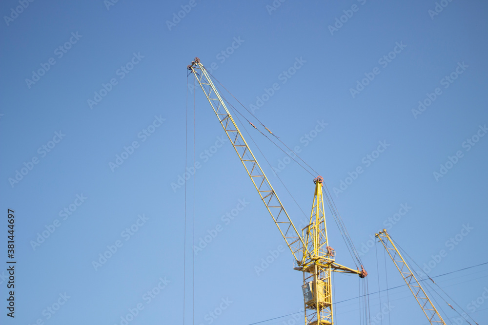 Tower crane at a construction site. Tower crane at a construction site.