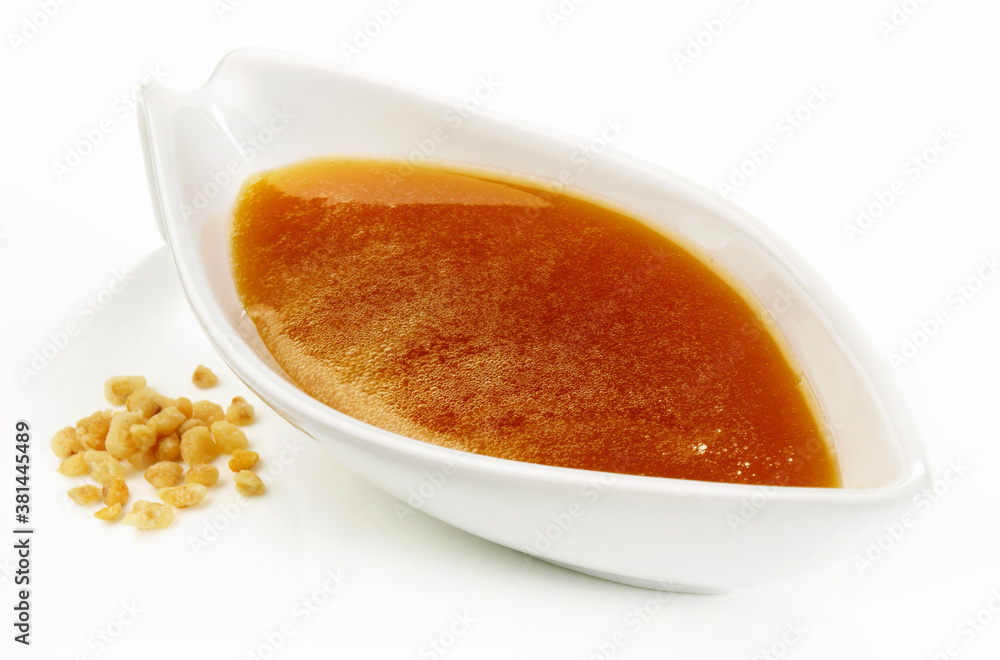 Caramel Dessert Sauce in a Sauce Boat on white Background - Isolated Caramel Dessert Sauce in a Sauce Boat on white Background - Isolated