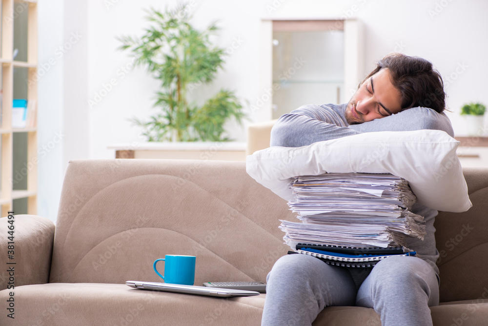 Young male employee freelancer working from home Young male employee freelancer working from home