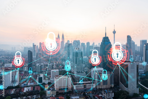 Photography Hologram of Padlock on sunset panoramic cityscape of Kuala Lumpur, Malaysia, Asia