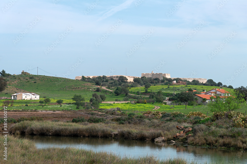Castro Marim, Algarve, Portugal - February 2020: On top of a knoll the castle Castro Marim, Algarve, Portugal - February 2020: On top of a knoll the castle