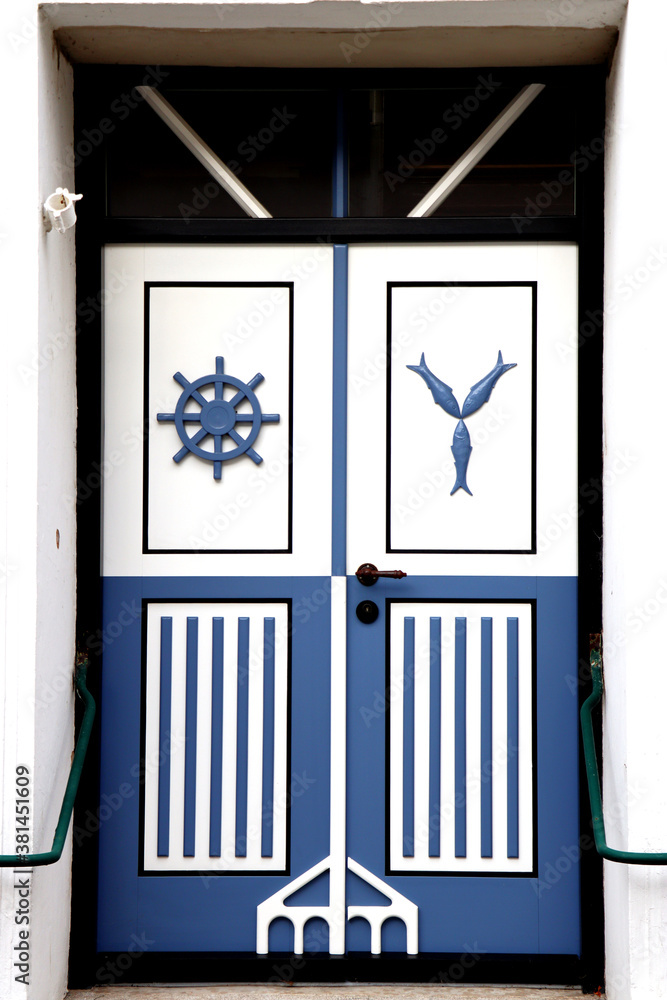 Fototapeta premium White and blue decorated front doors - marine decoration