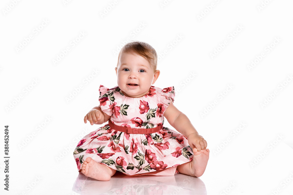 Pretty baby in beautiful dress sitting on floor Pretty baby in beautiful dress sitting on floor