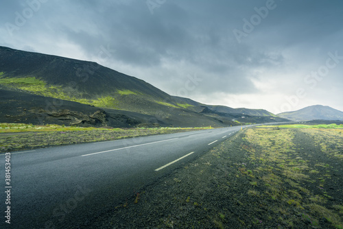 Icelandic landscape with asphalt road