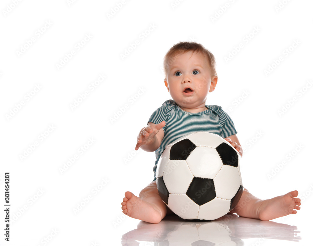 The child playing with a ball on a white background The child playing with a ball on a white background