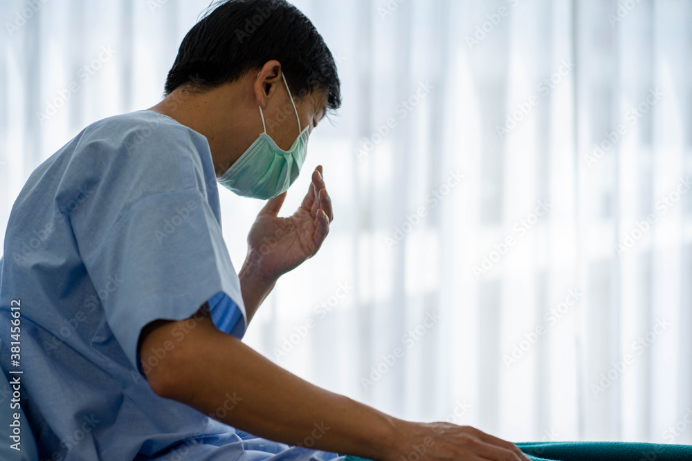 Senior Asian patient man infected from virus sitting in hospital. Health care and medicine concept. Senior Asian patient man infected from virus sitting in hospital. Health care and medicine concept.