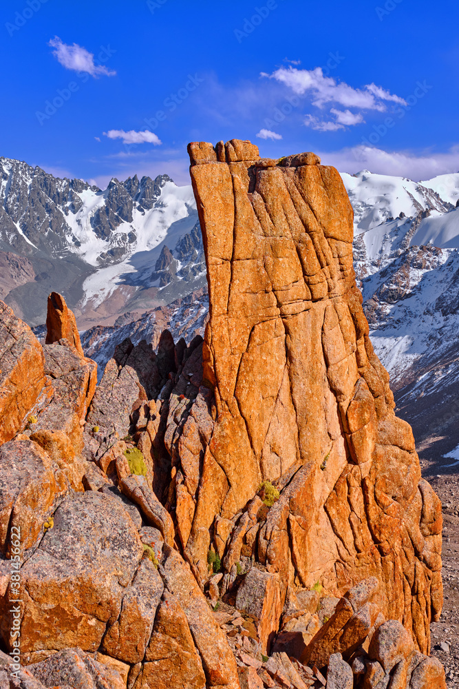 Delightful form of granite rocks in high mountains with glaciers; Tien-Shan mountains at sunset
