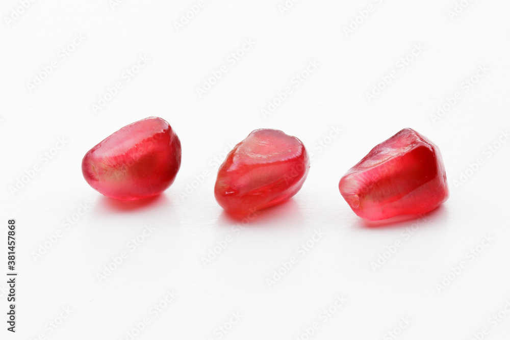 pomegranate seeds red autumn fruit on white background pomegranate seeds red autumn fruit on white background