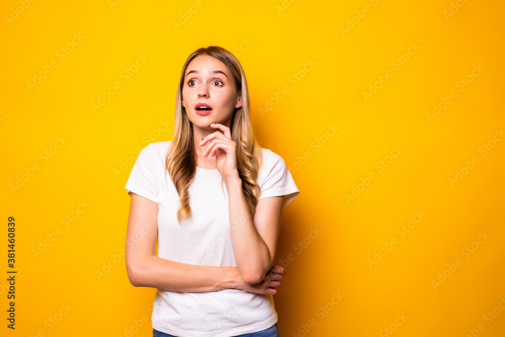Portrait of young woman think thoughts touch chin hands isolated over bright color background Portrait of young woman think thoughts touch chin hands isolated over bright color background
