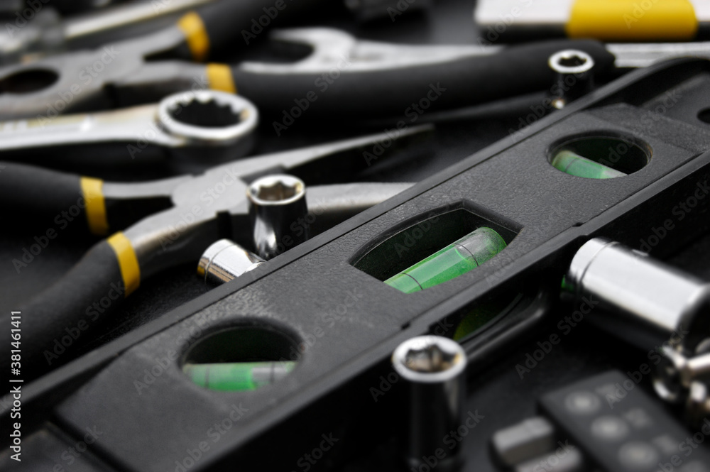 Many different tools for repair work on a black background. Many different tools for repair work on a black background.