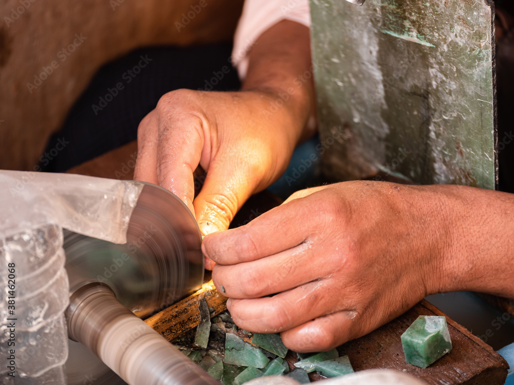 Burmese people working and trading precious gems in a specialized market of Mandalay, Myanmar (Burma) Burmese people working and trading precious gems in a specialized market of Mandalay, Myanmar (Burma)