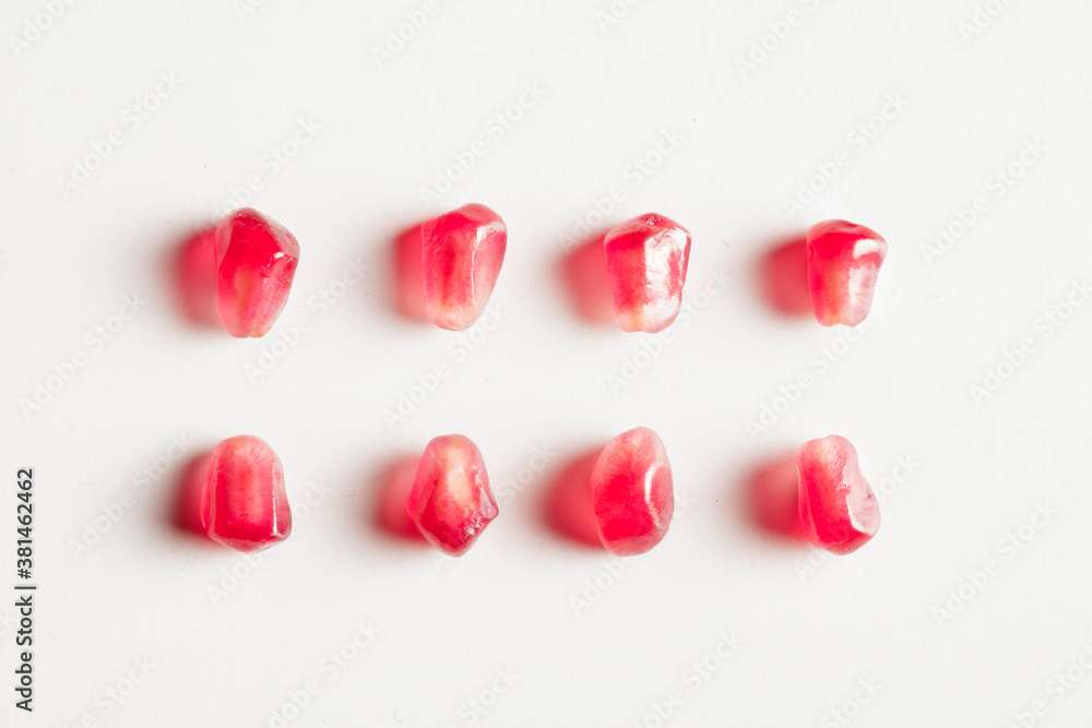 pomegranates group isolated seeds on white background pomegranates group isolated seeds on white background