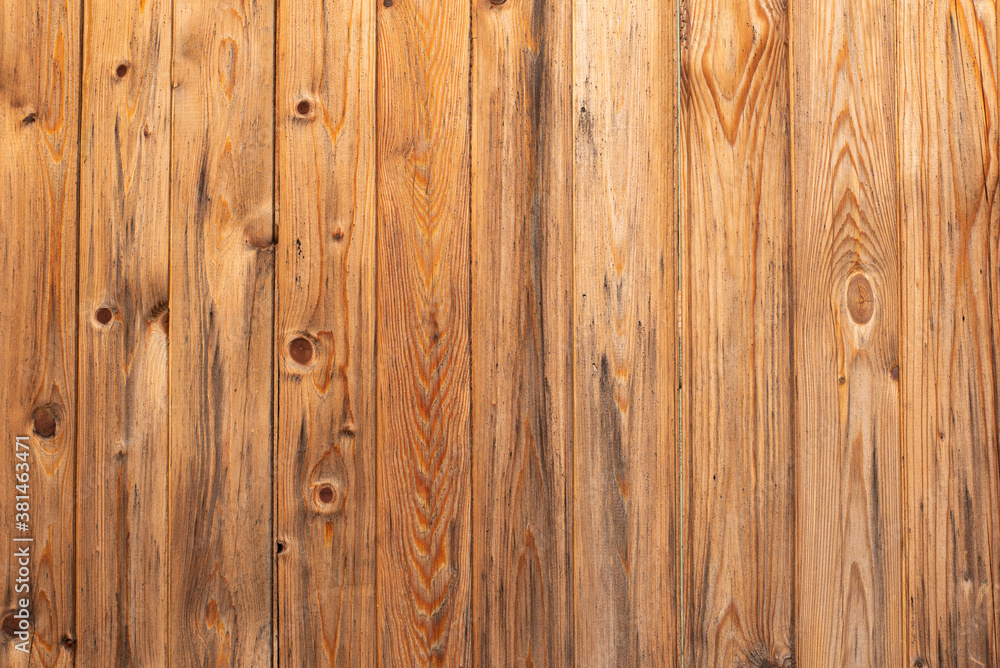 unpainted wooden paneling in the vertical direction