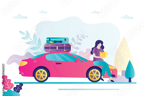Beautiful woman traveler holds  map in hands and makes a route, modern car with luggage. Vacation, travel time banner.