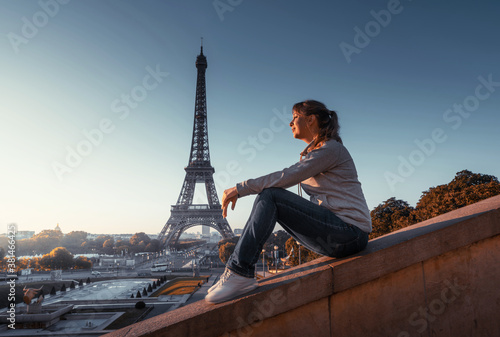 woman and Eiffel tower in sunrise time, Paris, France © Iakov Kalinin