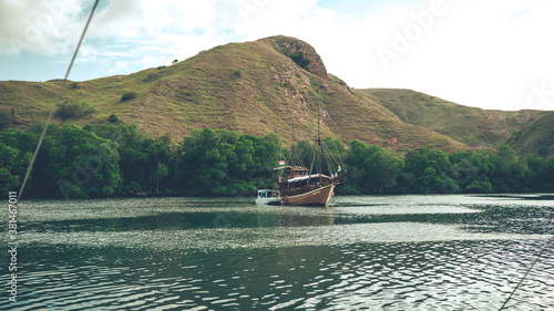 fishing boafishing boat on the lake, leisure and travel concept, beautiful sea bay with hills and mountains. Soft focust on the lake photo