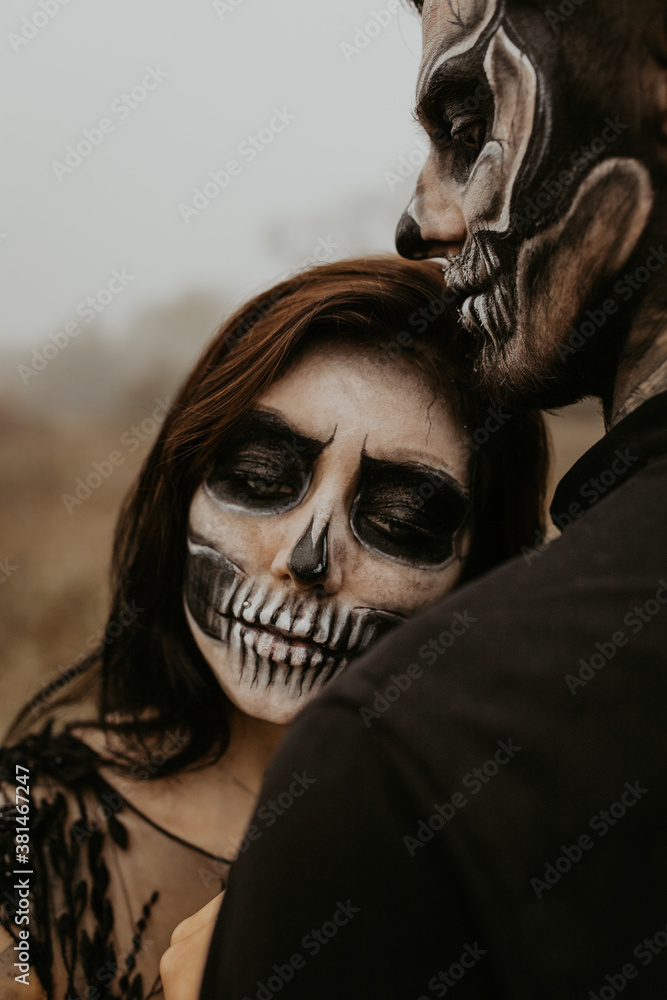 Couple with dark skull makeup. Halloween face art. Adult. Couple in love. Passionate concept. Halloween concept. Fashion photo. Just one kiss. Kissing man and woman. female. Couple with dark skull makeup. Halloween face art. Adult. Couple in love. Passionate concept. Halloween concept. Fashion photo. Just one kiss. Kissing man and woman. female.