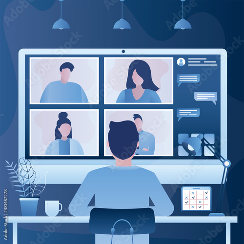 Businessman or man employee sits in front of monitor screen, back view. Video conference. Online meeting work form home.