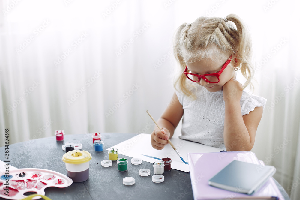 Child with a paints. Kid in a class. Little girl drawing. Child with a paints. Kid in a class. Little girl drawing.