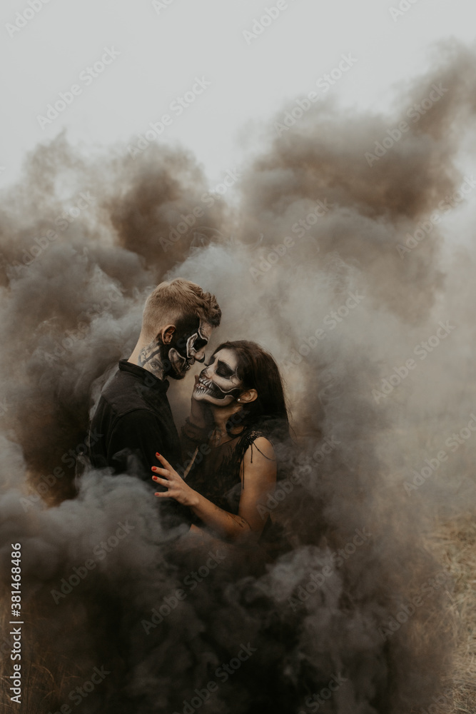 Lovely couple in black smoke halloween. Authentic love and natural light.
