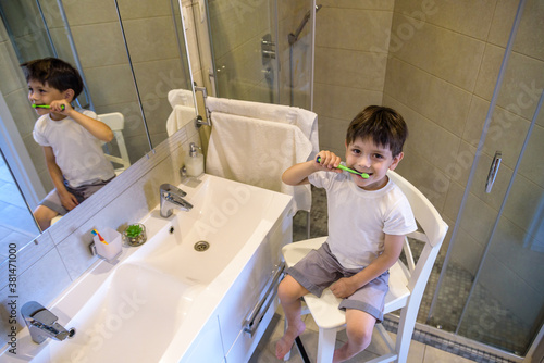 Cute toddler boy brushing teeth. Teeth cleaning, dental care. adorable baby boy washing up