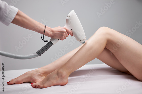 Canvastavla young female on laser epilation in salon, get hair removal by professional speci