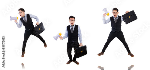 Young businessman with loudspeaker on white