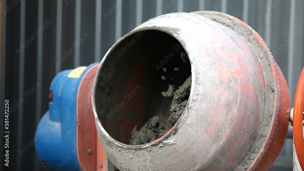 Beton mixer rotating. Cement mixer used at the construction site Beton mixer rotating. Cement mixer used at the construction site