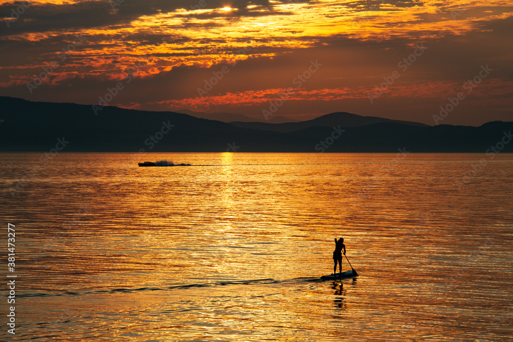 Paddleboater on Lake Champlain at Sunset in Vermont Paddleboater on Lake Champlain at Sunset in Vermont