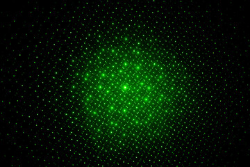 Abstract lines of green laser light on black background