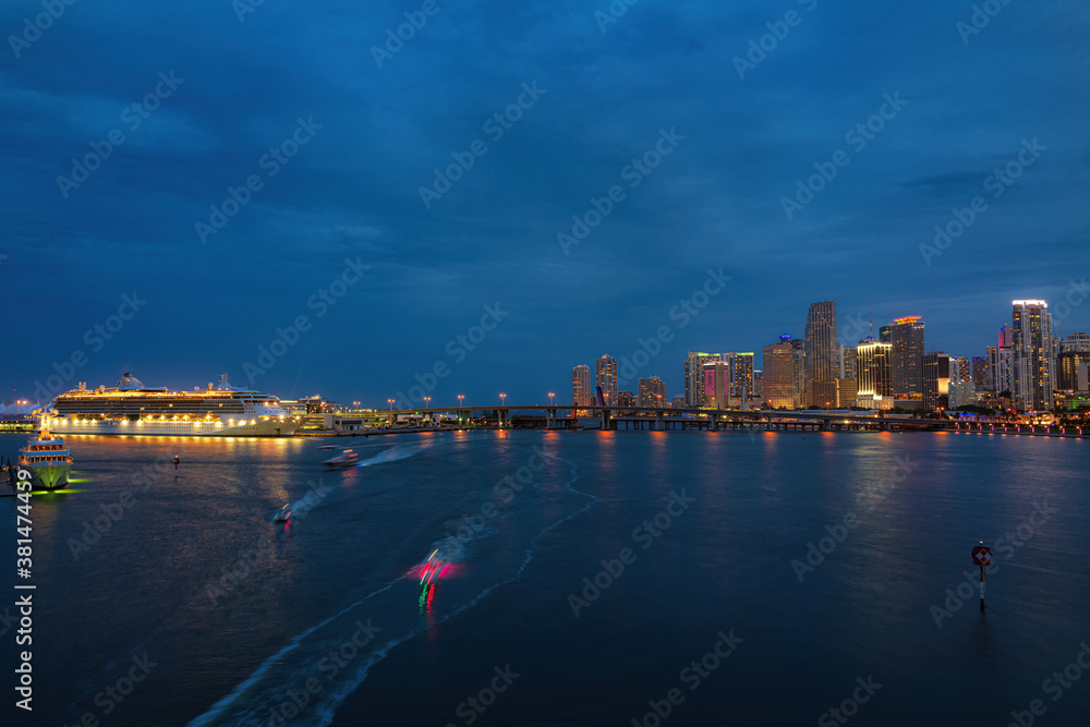 Beautiful colorful city of Miami Florida skyline and bay with night clouds. Miami.